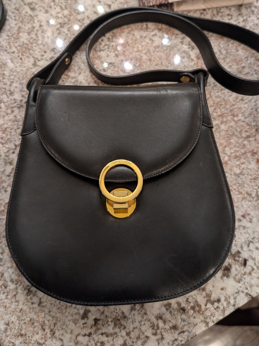 Classic Black Leather Crossbody with Gold Ring Accent